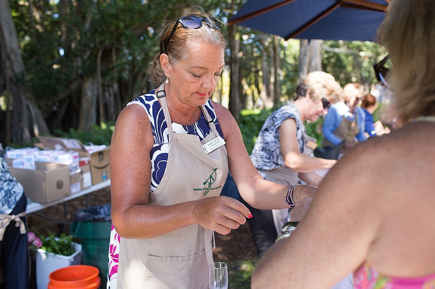 Mary Beth Goddard teaches a guests how to make the vase.