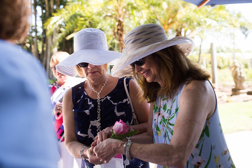 Lynn Soussou and Debbie Partridge make a vase.