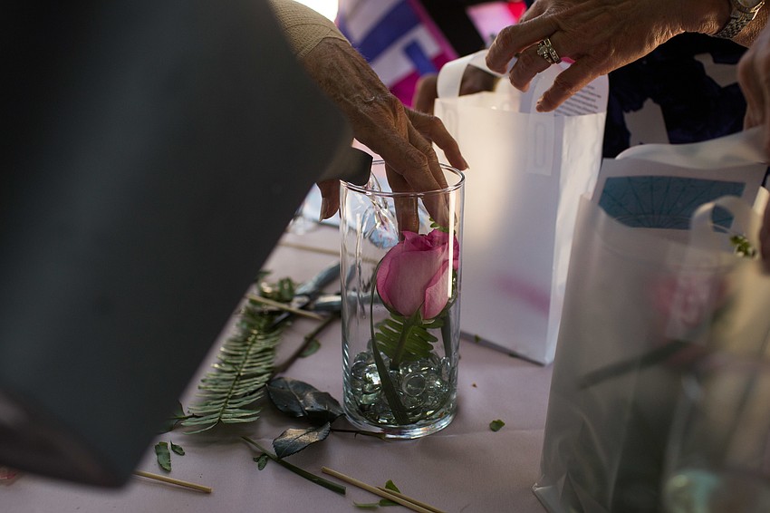 The vases were filled with water after the rose was placed inside.