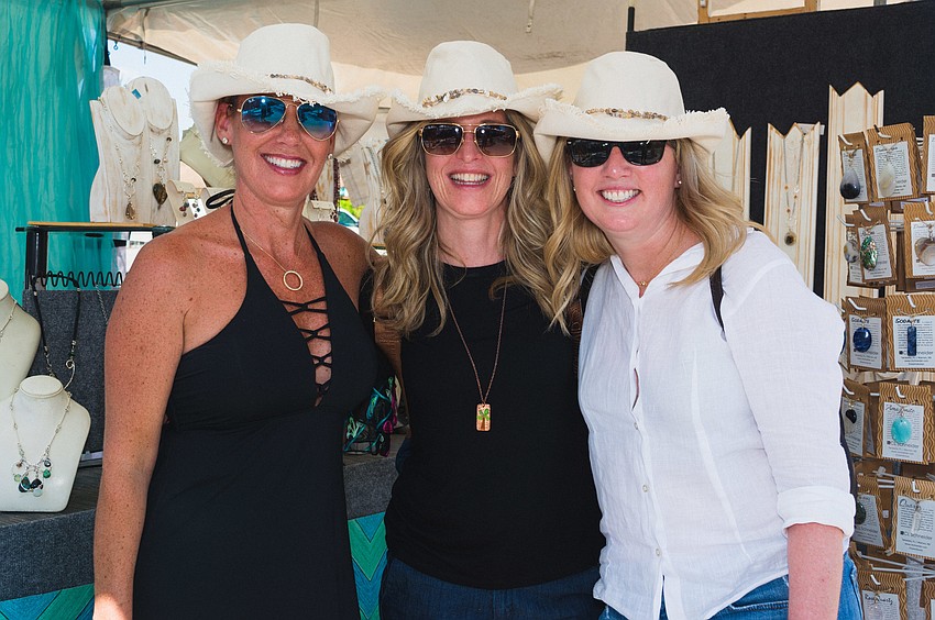 Leslia Quinn, Kara Becker and Marie Mastro with brand new hats they found at Siesta Fiesta.