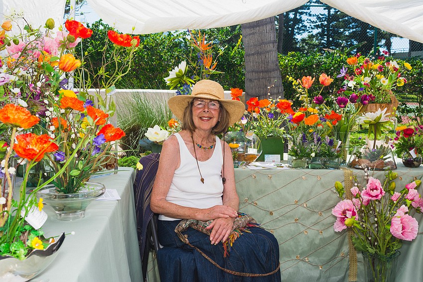 Bonita Mertes sells her beautiful flowers at Siesta Fiesta.