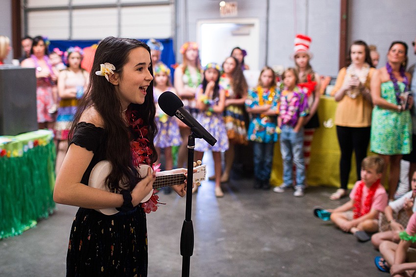 In true Hawaiian style, the Spotlight Kids performed with ukuleles.