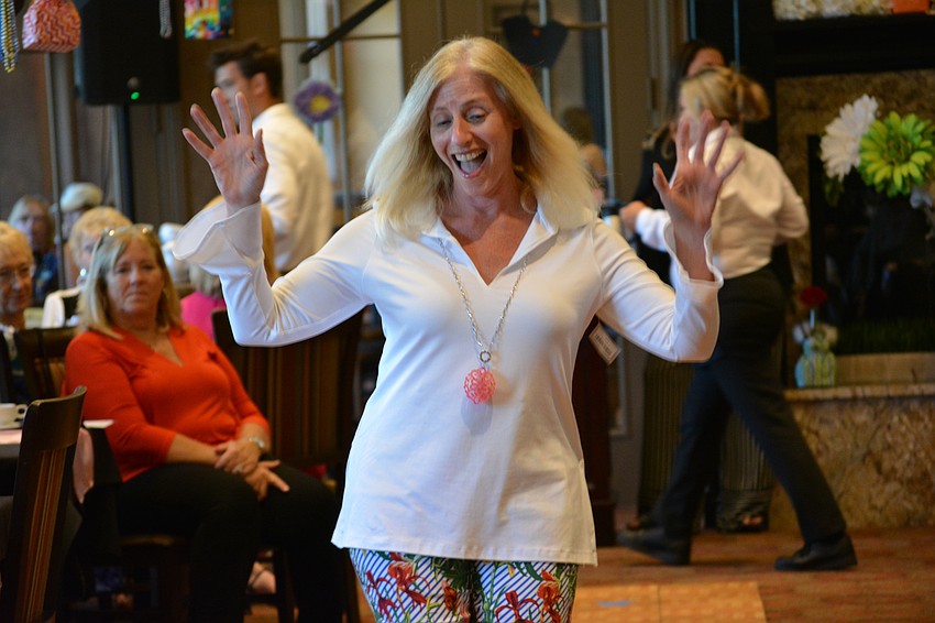 Elaine Lahm stops to have a little fun on her trip down the runway.