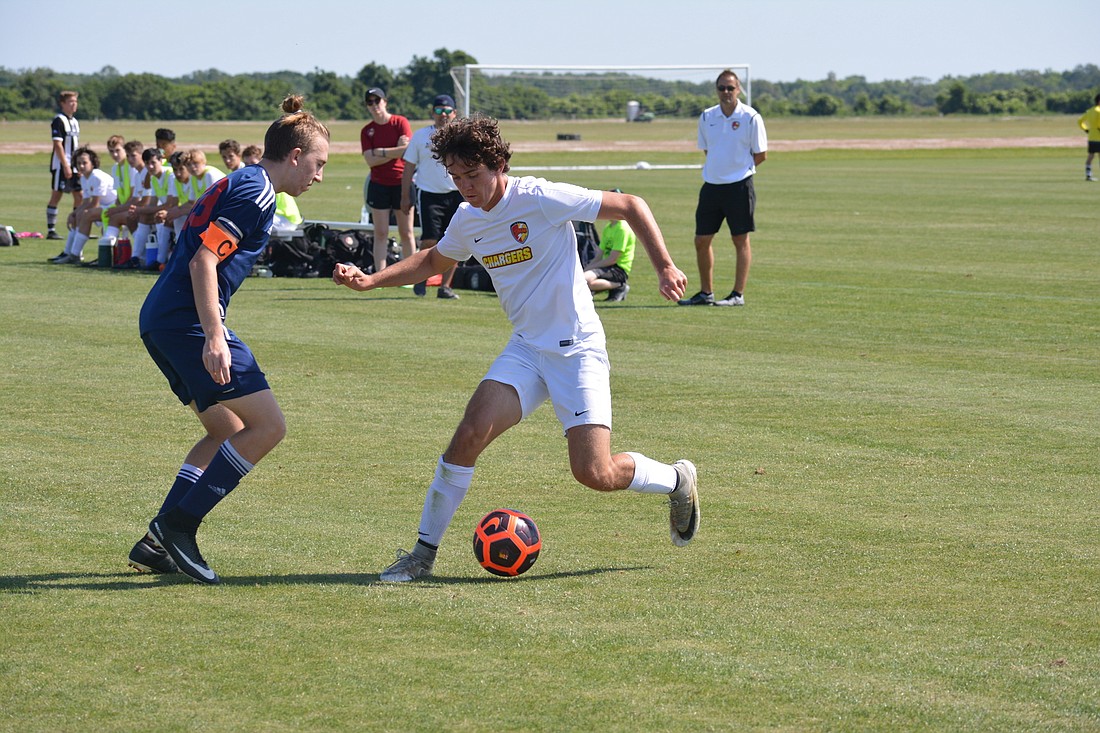Lakewood Ranch Chargers U17 player Noah LaBelle, here putting a juke on a defender,  performed well during the Sarasota Cup, in front of 46 college coaches.
