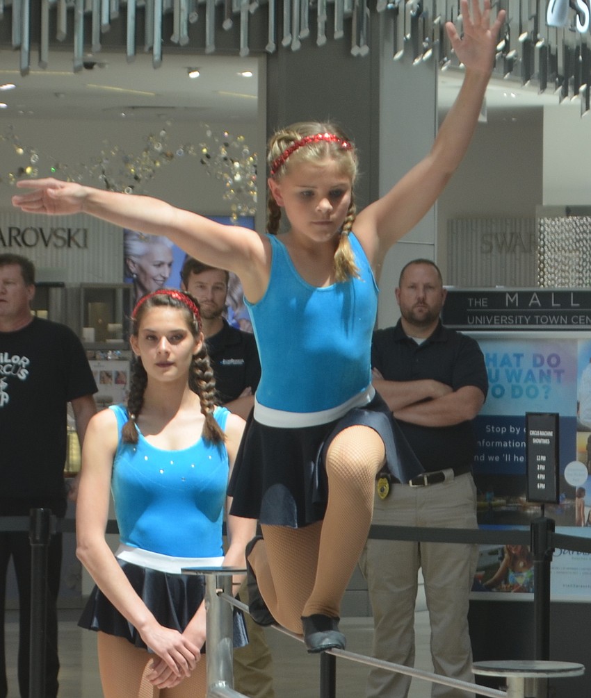 Callahan Harchuck, a fourth-grader from Sarasota, balances her weight carefully as she walks across the wire.