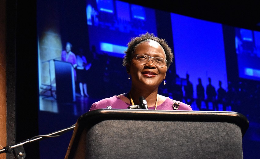 Co-Chairwoman Rachel Shelley welcomes the crowd while her students cheer.