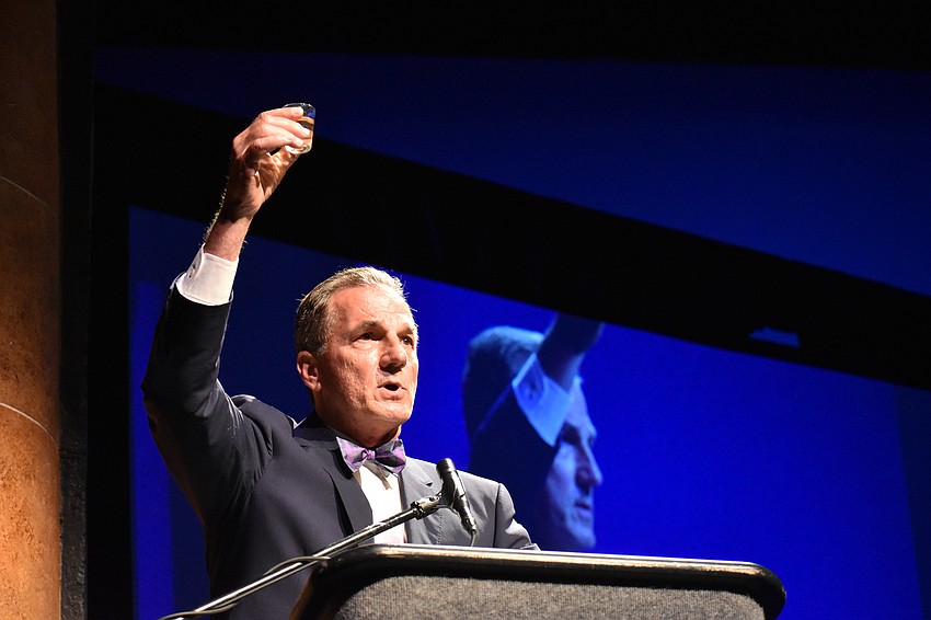Narrator Bill Partridge toasts to the late Judge Frank Johnson.