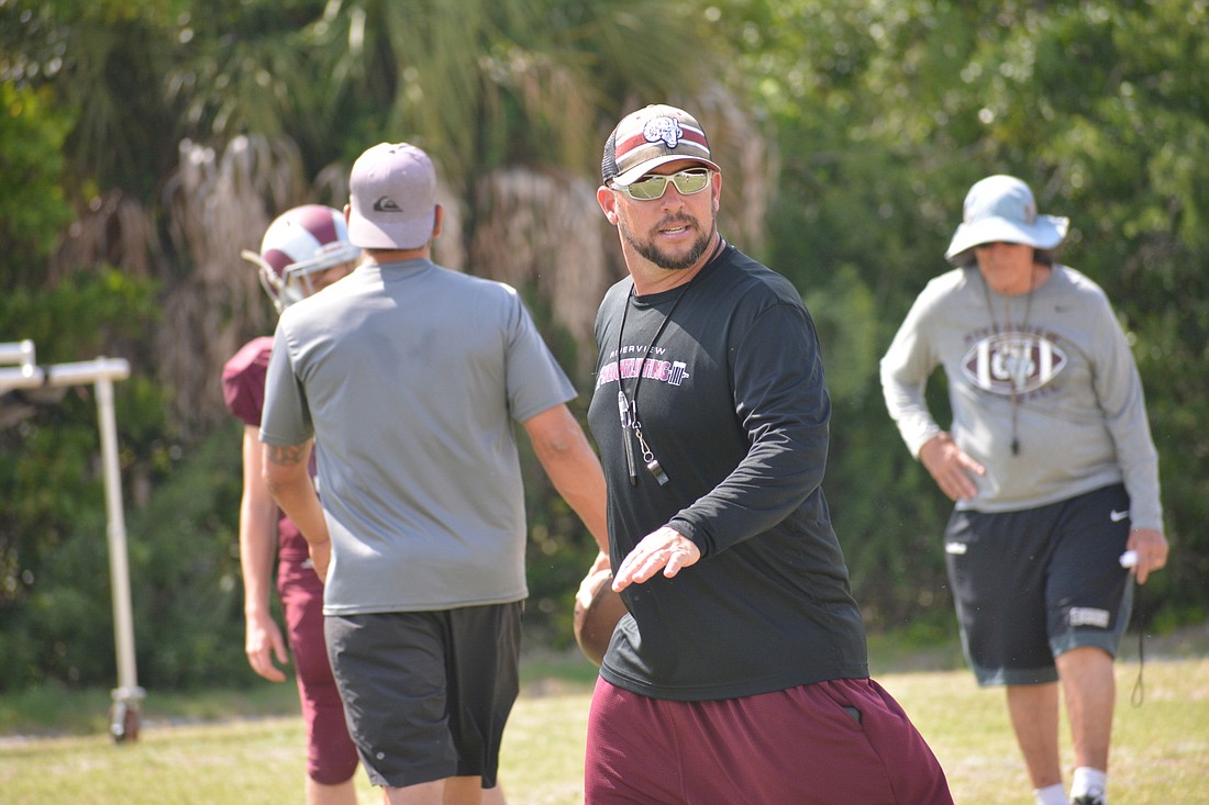 Josh Smithers watches over his Riverview High team at spring practice.