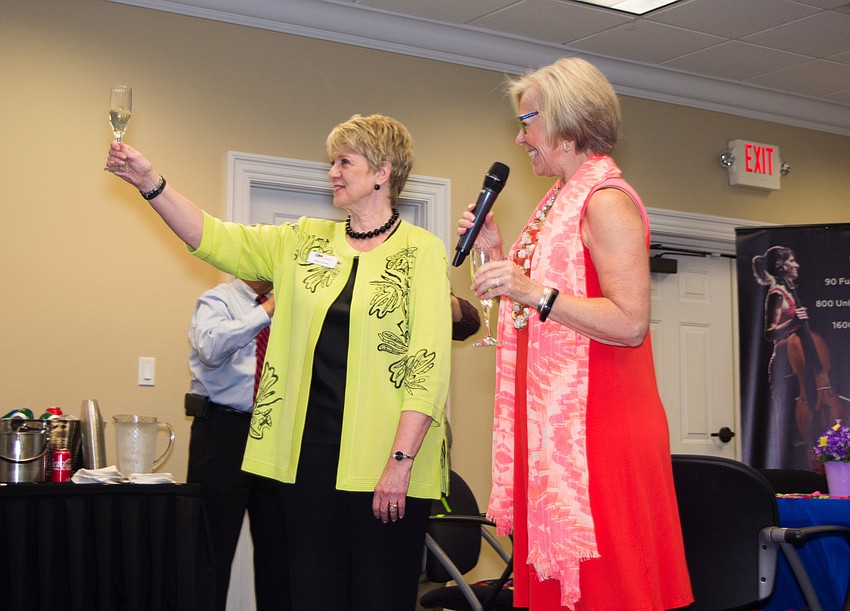 Patterson Foundation CEO and president Debra Jacobs toasts the end of the Giving Challenge with Roxie Jerde.
