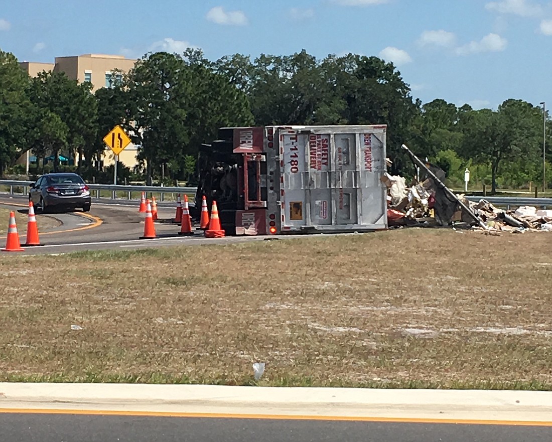An overturned truck Thursday morning has closed a northbound ramp to Interstate 75 at University Parkway.