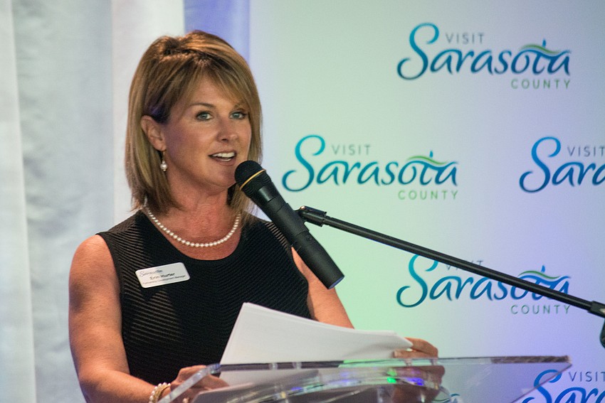 Visit Sarasota County's visitor experience manager Erin Hurter invites award nominees to the stage.