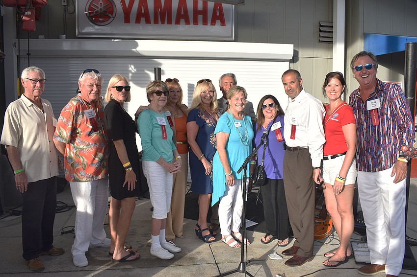 Previous chamber chairmen and women pose after being introduced to the crowd.