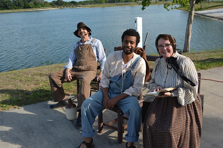 Barry Look, as Pa Finn and Silas, Jean Paul Monde as Jim, and Julie Look as Miss Watson and Sally, perform on opening night of the three-night run.