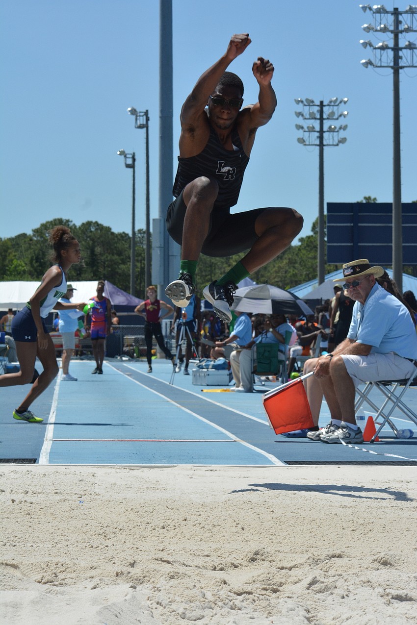 Lakewood Ranch senior Harry Barthelemy takes the leap during the 4A boys long jump.