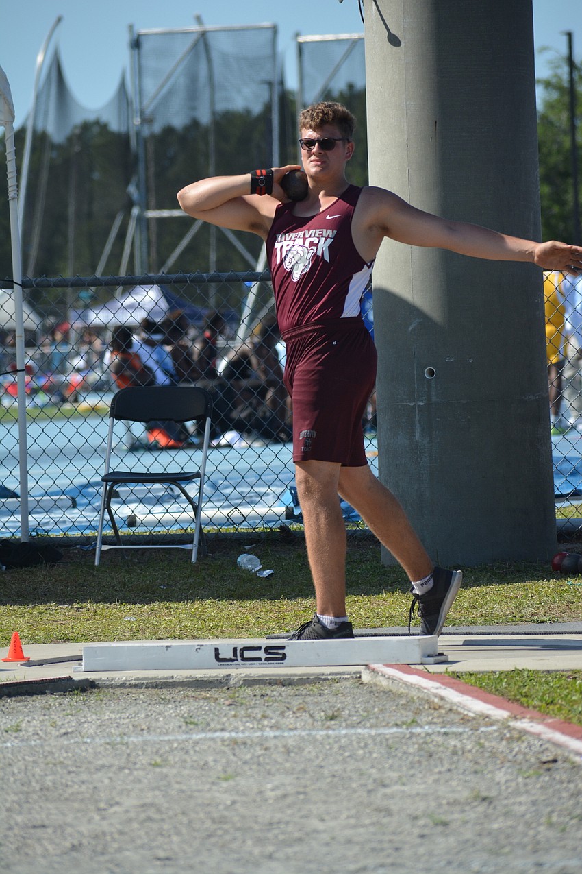 Riverview High senior Wojciech Przepiora prepares to launch the shot put in the boys 4A event. He finished 13th overall (49.21 feet).