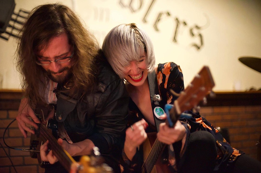 Josh Scheible and Lesa Silvermore jam out at their last show at Growler&#39;s Pub. Photo by Trey Jones