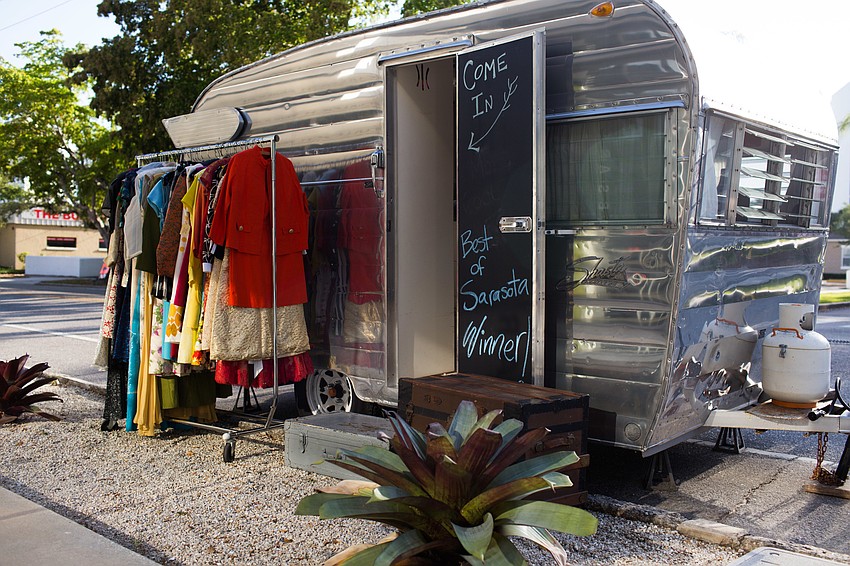 A vintage camper sat outside for guests to browse.