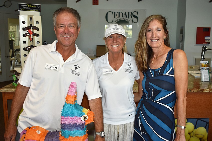 Turtle Watch President Tim Thurman, Terri Driver and Turtle Watch Vice President Cyndi Seamon