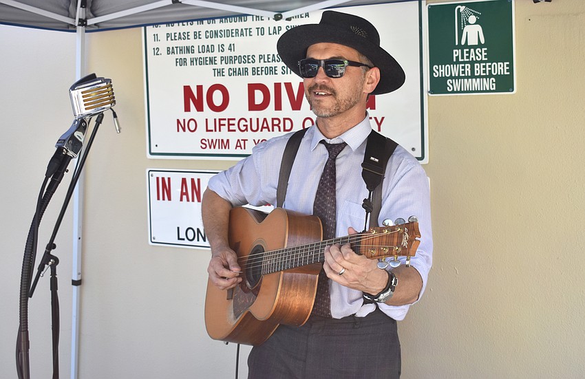 Singer-songwriter Dean Johanesen performs for guests as they eat.