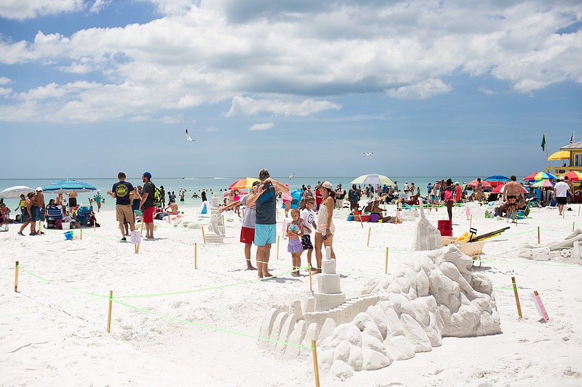 Many beachgoers took photos of the works of art.