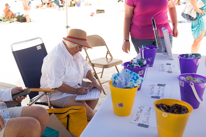 Grace Whitehouse tallies up the votes for the winners.