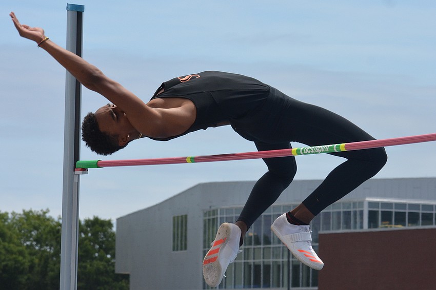 Sarasota High senior Jaasiel Torres clears the bar at  7.03 feet to repeat as the 4A boys high jump champion.