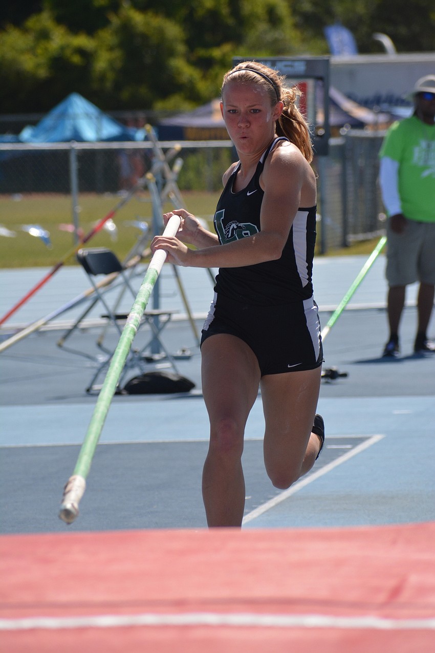 Karen Kay Lyvers is all business as she runs toward her 4A girls pole vault launch.