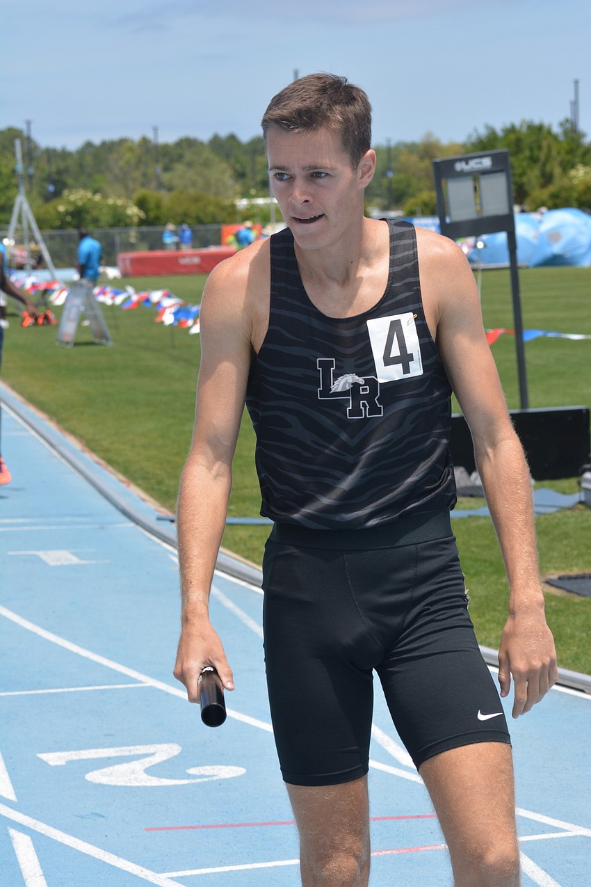 Lakewood Ranch's Johnny Reid grimaces after finishing finished fourth (8:01.04) in the 4A boys 4x800 relay.