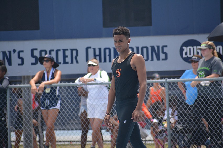 Sarasota's Jaasiel Torres stares down the 4A boys high jump.