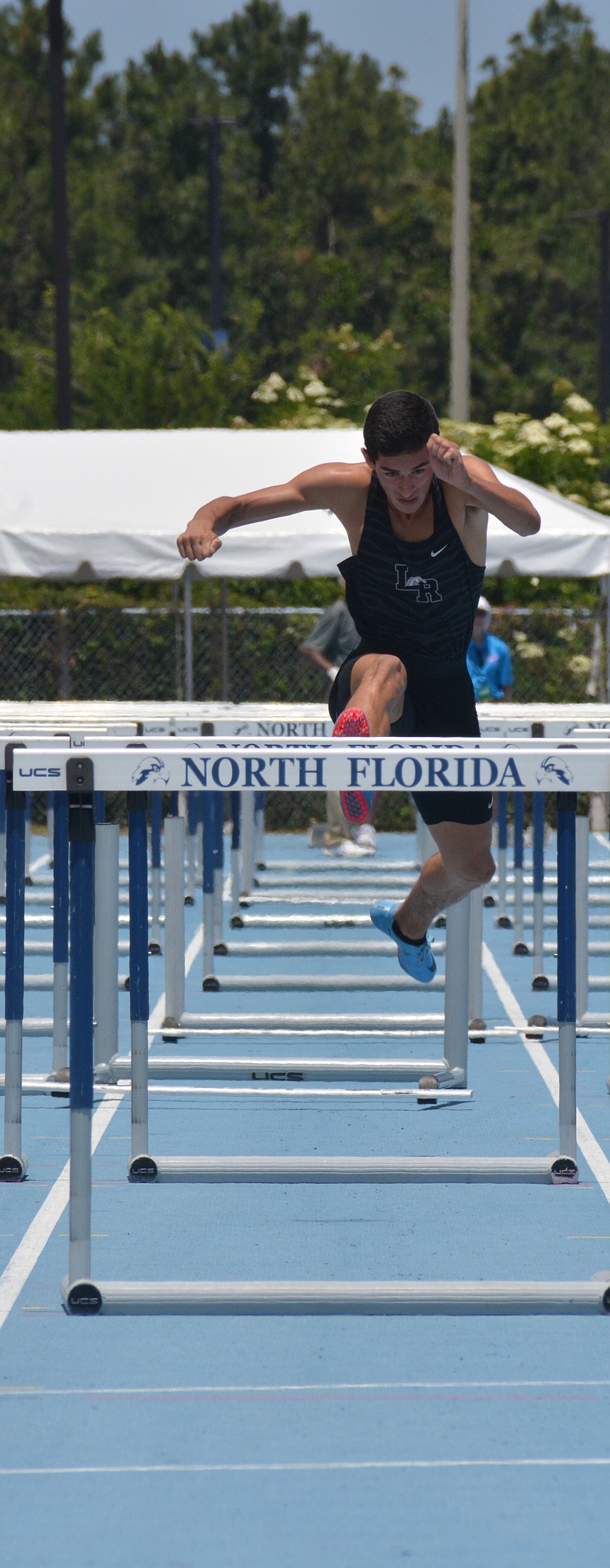 Lakewood Ranch junior James Rivera traverses the 4A boys 110-meter hurdles.