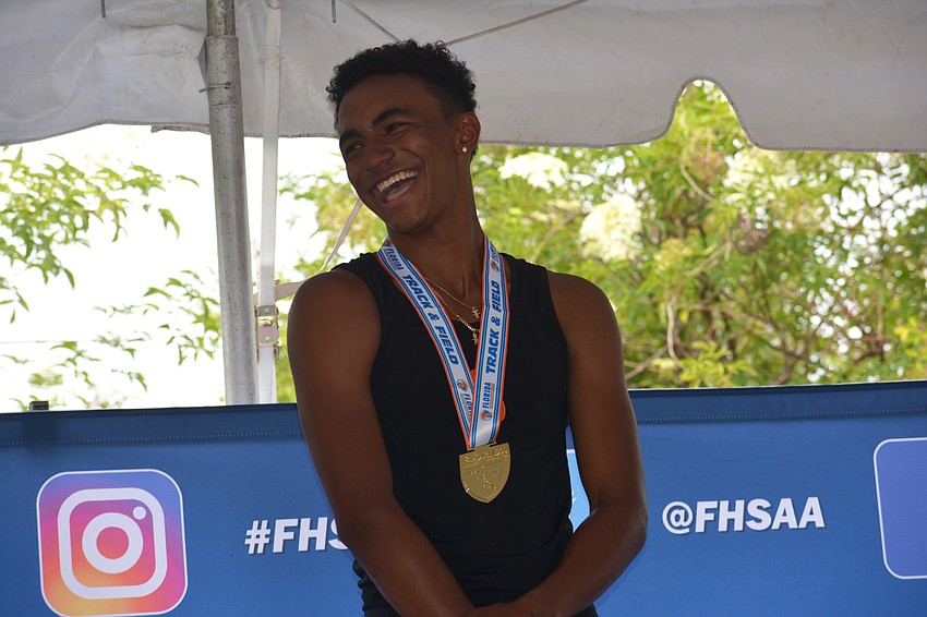 Jaasiel Torres is all smiles after repeating as the 4A boys high jump champion.