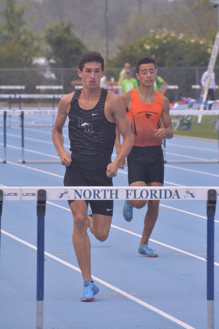 Lakewood Ranch junior James Rivera races to the 4A boys 300-meter hurdles finish line. Rivera won the event in 37.14 seconds.