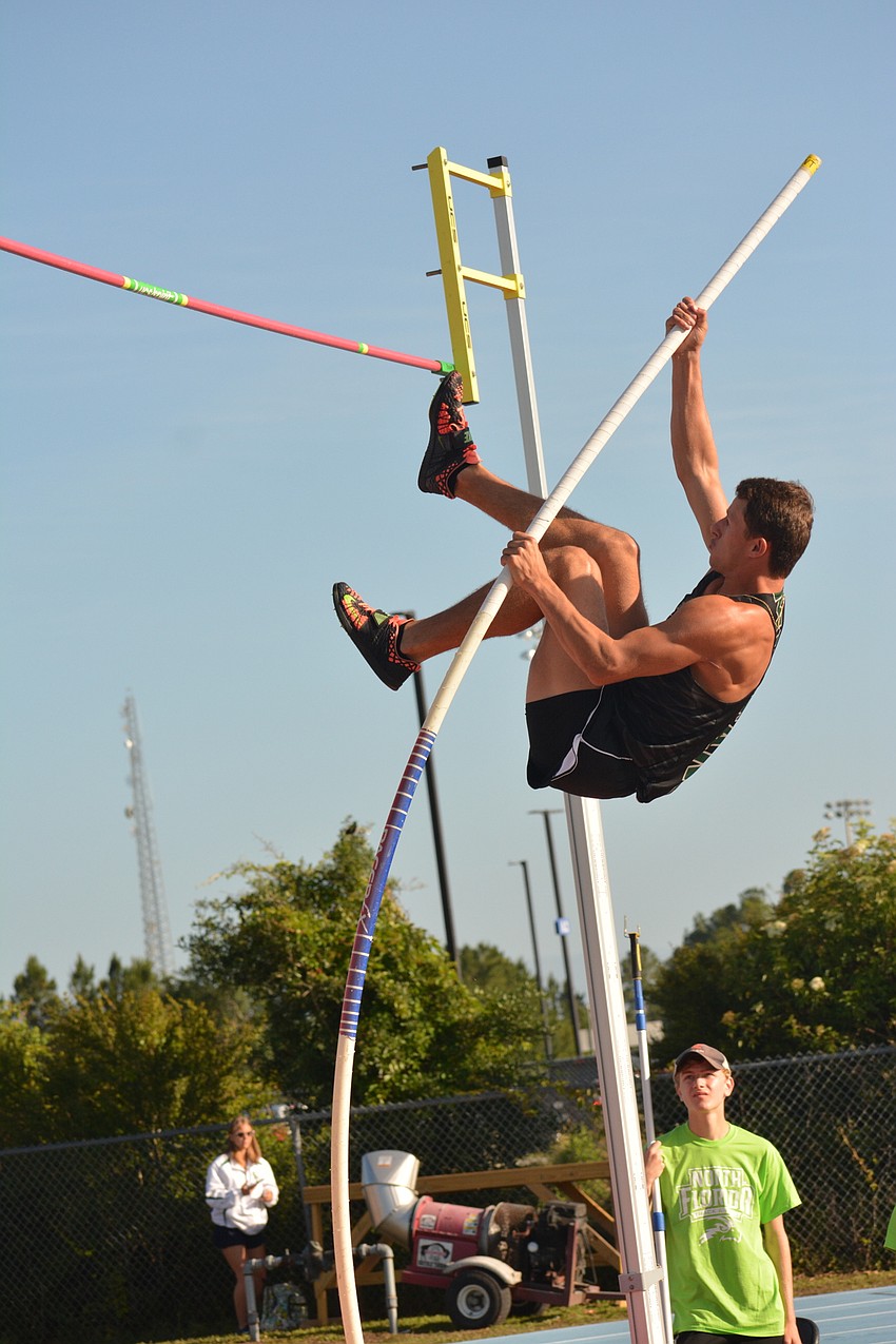 Lakewood Ranch senior Drew Butler bends his pole and lauches himself during the 4A boys pole vault.