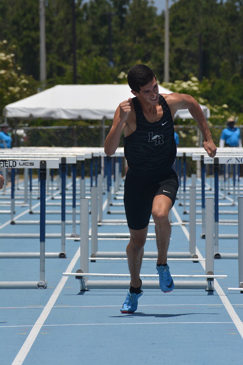 James Rivera charges home in the 4A boys 110-meter hurdles.