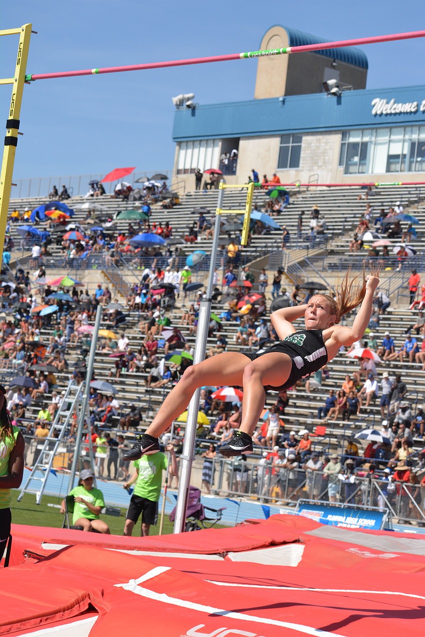 Karen Kay Lyvers realizes she cleared the 4A girls pole vault bar after bumping it.