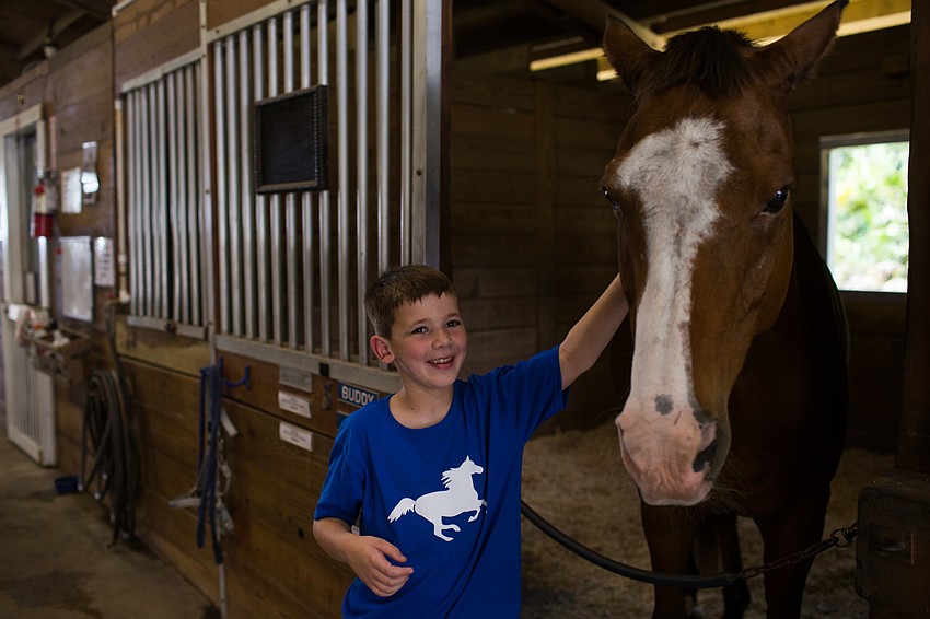 Joseph Woolbert pets Buddy.