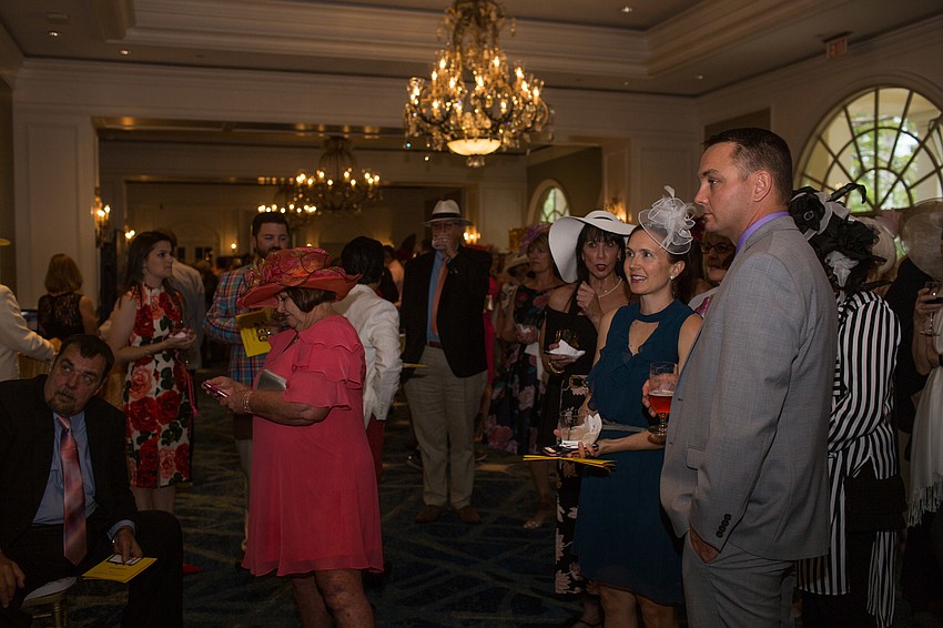 Guests gathered around the TVs to watch the race.