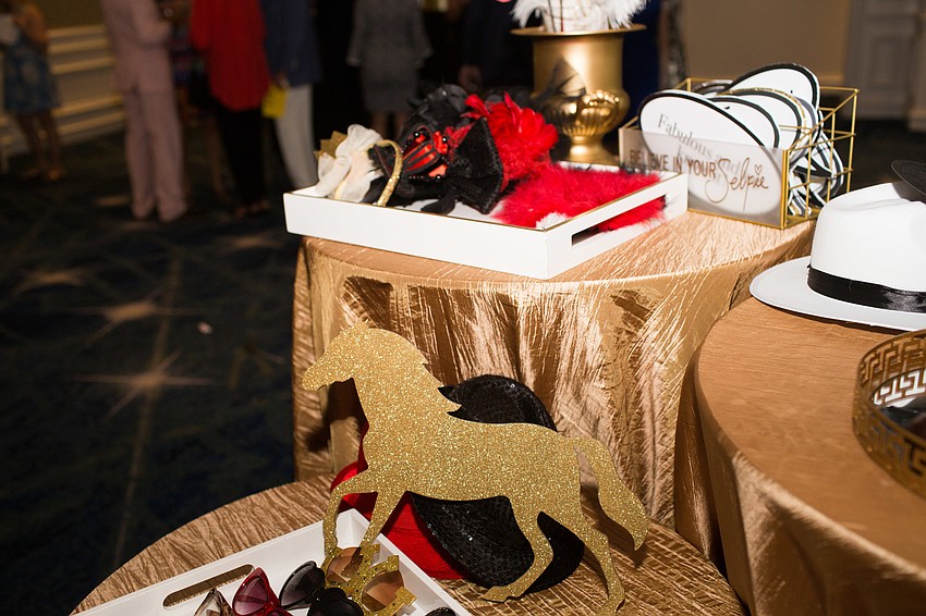 Hello Gorgeous set up a photo booth with Kentucky Derby props.