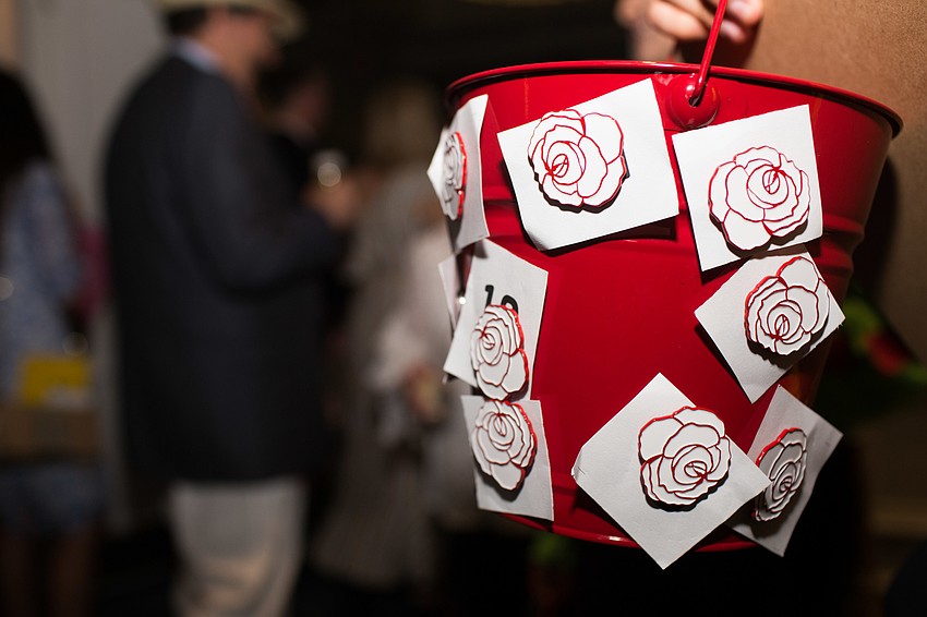 Guests could purchase a rose magnet for $100.