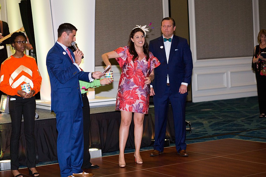 Chairwoman Lea Buchanan draws a name out of the bucket for a prize.