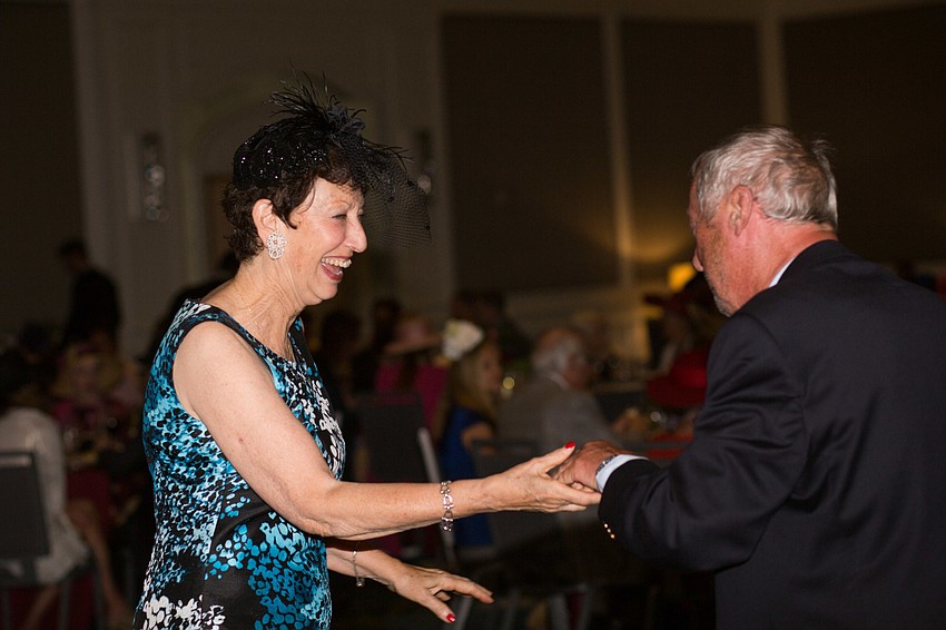 David Hagberg and Carol Cohen dance to the music.
