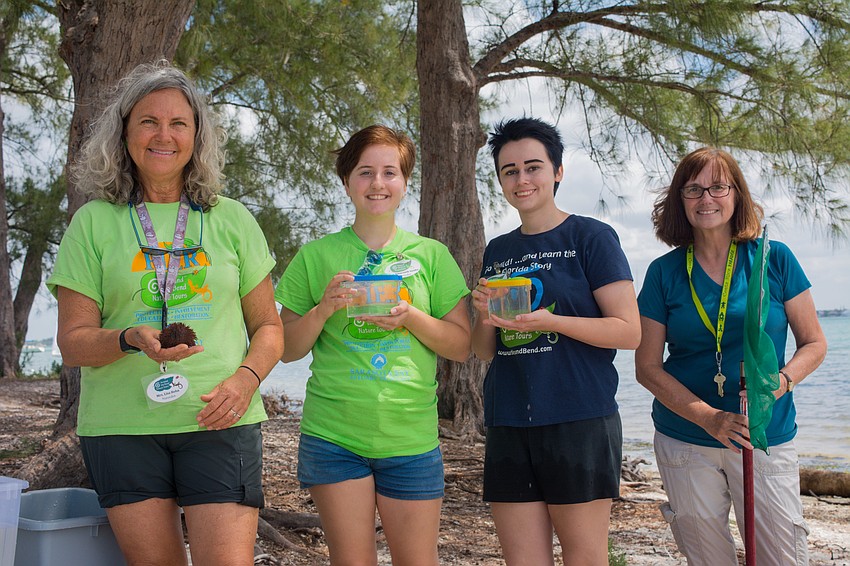 Volunteers Lisa Bohn, Amaranth Sandler, Kaylynn Low and Edie Banner collect sea life specimen from the Sarasota Bay.