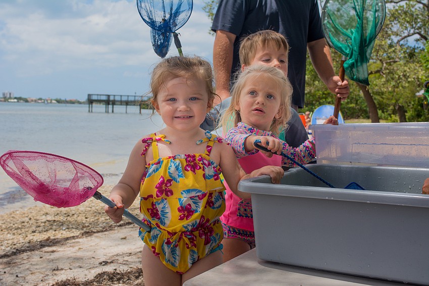 Quinn Ott, Madison Wright and Hayden Wright learn more about Sarasota Bay sea life.