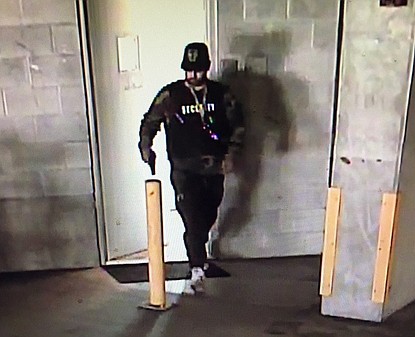 Sarasota police released this security video image of the man they say fired shots into an unoccupied Main Street condo unit.