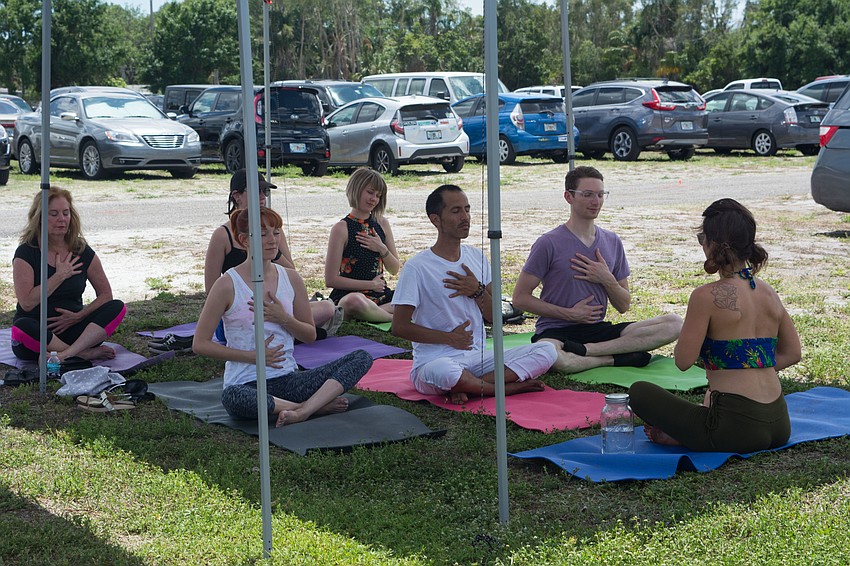 Kai Yoga offers a yoga demonstration.