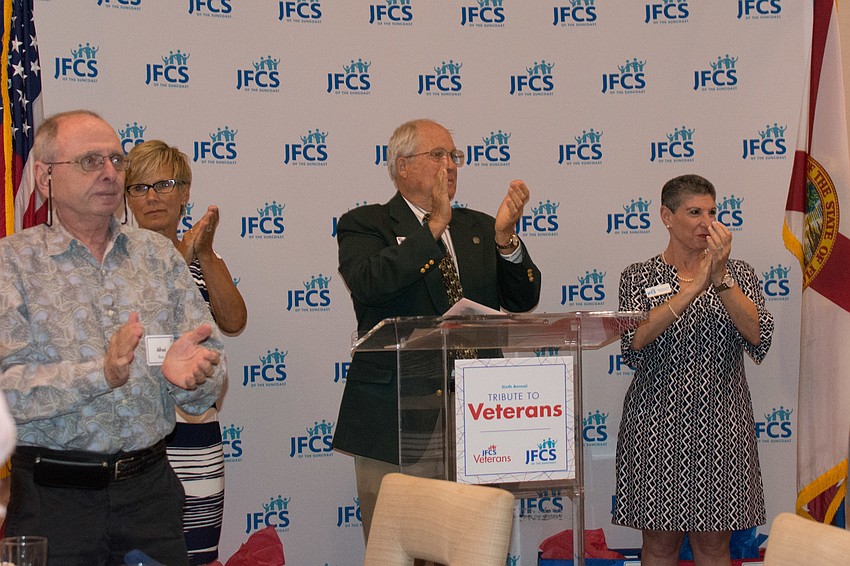 Members of JFCS and its community partners recognize local veterans.