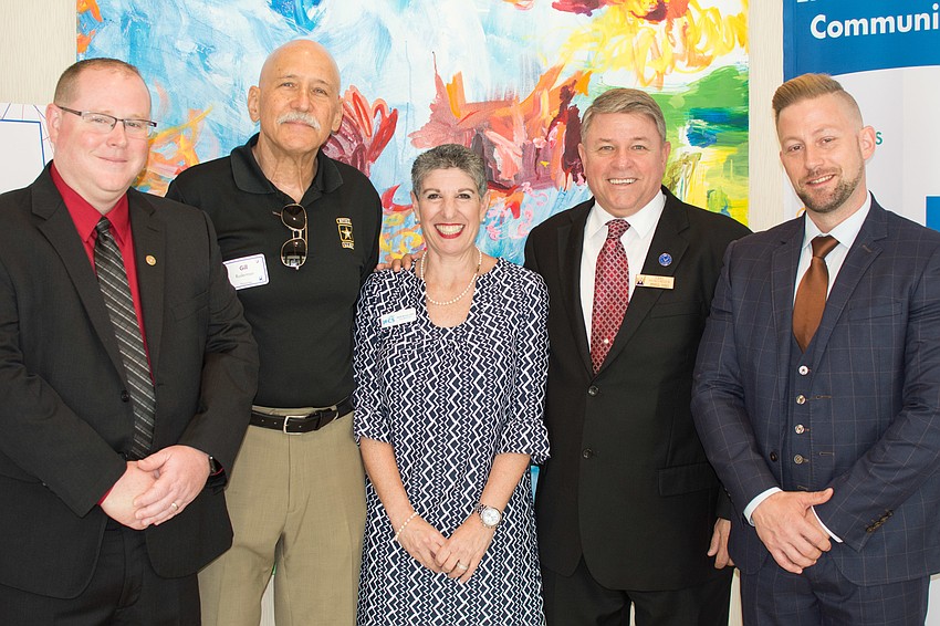 Awardees Christopher Nothdurft, Gill Ruderman, Carl Hunsinger and Bryan Jacobs with JFCS CEO Heidi Brown, center.
