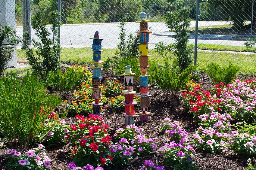 Totems in the Serentiy Garden were put together by Oak Park School students.