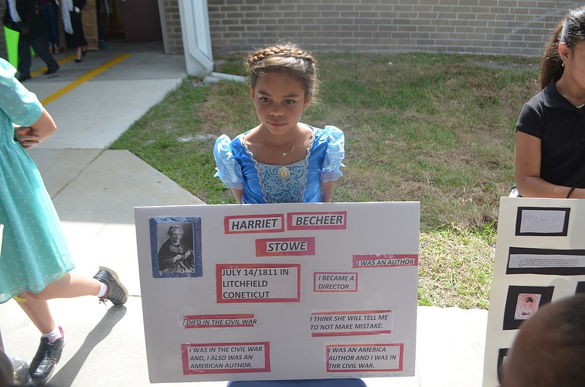Paula Ramirez, a fourth-grader, dressed up in her only full-length ball gown to give a presentation on Harriet Beecher Stowe.