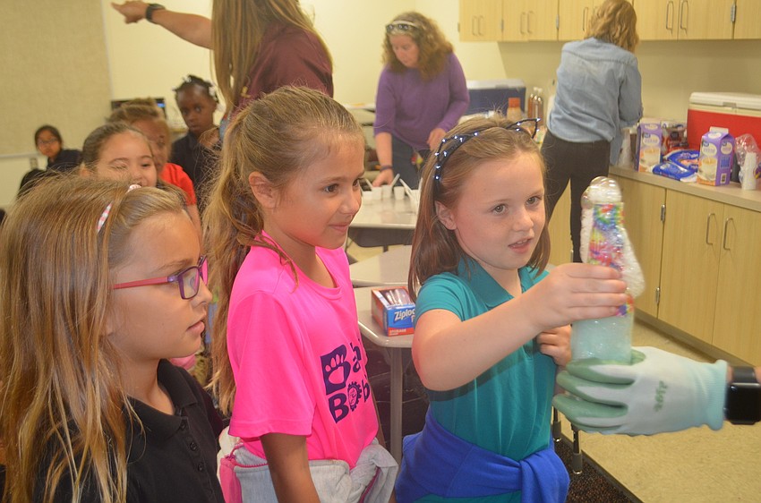 Makenzie Emery, Camilla Marquez and Brooklyn McDevitt, first-graders, thought that the dry ice combination felt different than they assumed it would, like it wasn't even there.
